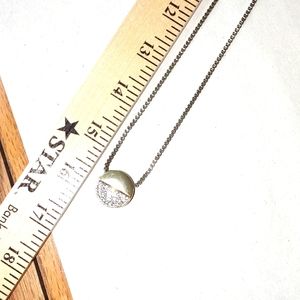 A long chain with the Maker's Mark on the clasp half pave half rhinestones or cz